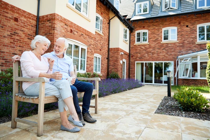 Senior Living couple enjoying time outside in a cottage community